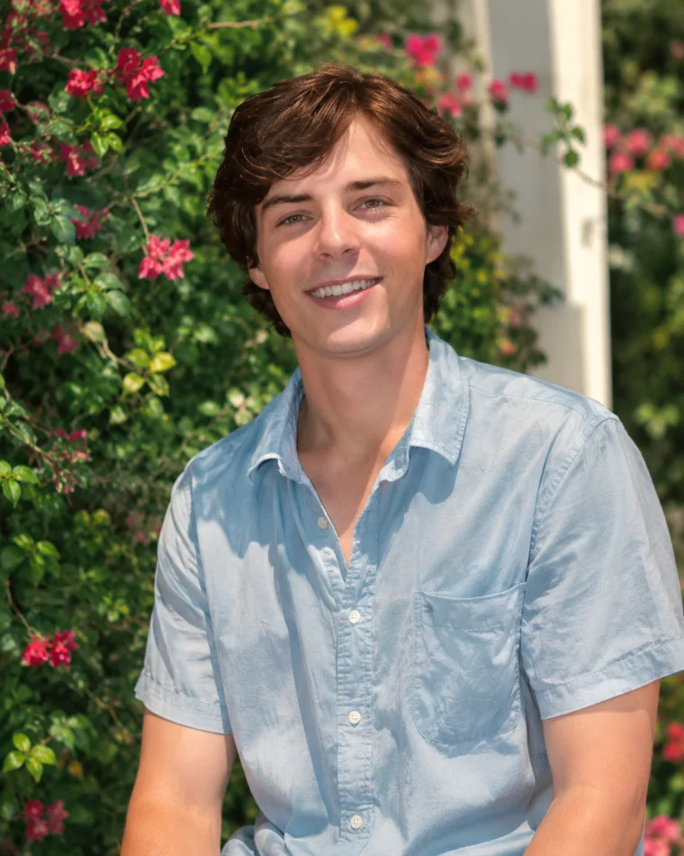 Portrait of a smiling man in a light blue shirt